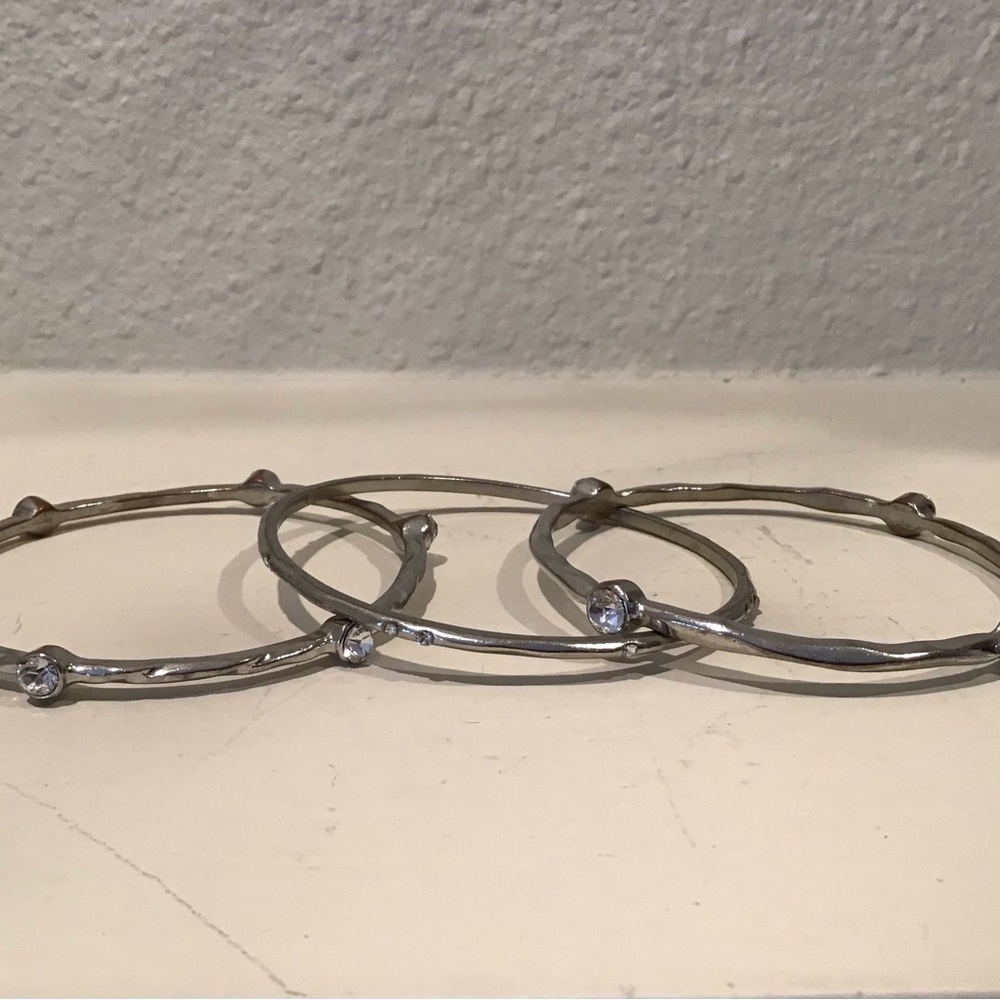 3 silver and rhinestone bangle bracelets. 2 1/2” diameter. Excellent condition